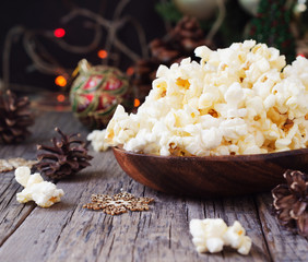 popcorn on the background of Christmas and New Year's decorations, selective focus