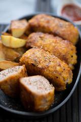 Close-up of roasted schnitzels with turkey meat, shallow depth of field, selective focus