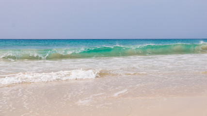 Fototapeta na wymiar Waves crashing on Santa Monica Beach, 18km of sand at the south of Boa Vista, Cape Verde