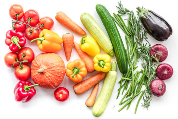 Colorful vegetables for healthy diet. Paprika, tomatoes, carrot, zucchini, eggplant on white background top view