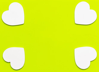 white hearts on light green background