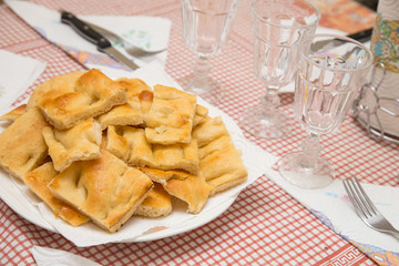 close up of dish on table with traditional Italian focaccia food product.jpg