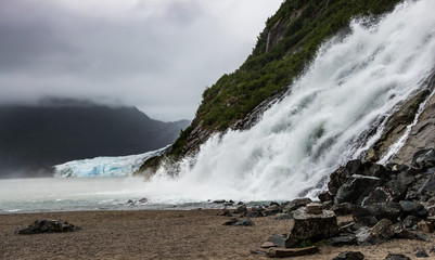 Nugget Falls and the Mendenhall. Nugget Falls is located near the Mendenhall Glacier north of Juneau, Alaska.