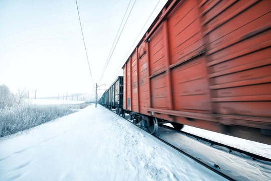 Fototapeta Winter railway and train with cargo.