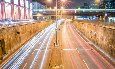 Fototapeta na wymiar BERLIN - NOVEMBER 16, 2013: City traffic at night. Berlin attracts 15 million people every year