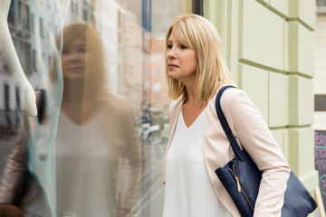 Woman window shopping shop window