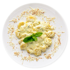 Potato dumplings Cheese and cream sauce. Isolated on a white background.