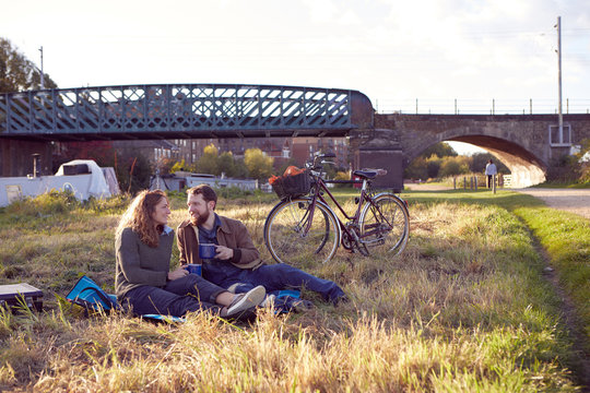 Couple enjoying coffee break on marshes