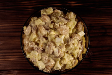 Salad with white kidney beans, potatoes, chicken meat, eggs and mayonnaise