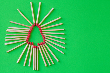 CHRISTMAS TREE SHAPE MADE UP OF MATCHES