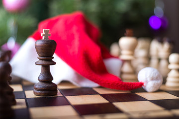 Christmas tree and chess board with figures.