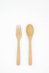 Wooden spoon and fork isolated on white background