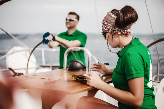 Couple sailing sailboat