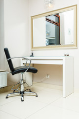 Chair and mirror in hairdresser salon