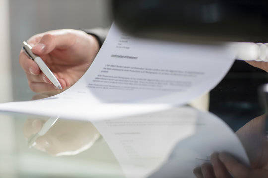 Cropped view of businessman reading contract