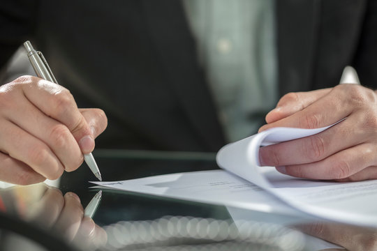 Businessman's hand signing contract