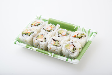 packed sushi in plastic tray