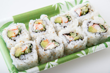 packed sushi in plastic tray