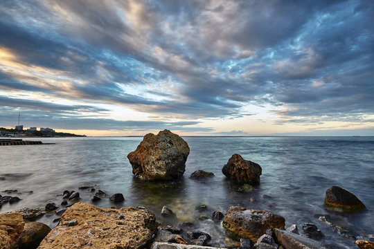 Rocks protruding from sea, Odessa, Odeska Oblast, Ukraine, Europe
