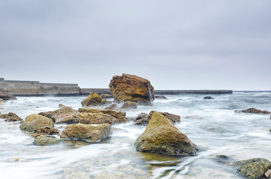 Rocks protruding from sea, Odessa, Odeska Oblast, Ukraine, Europe