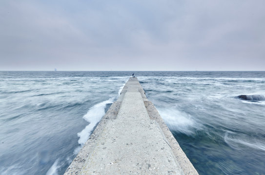 Person in distance on concrete pier, Odessa, Odeska Oblast, Ukraine, Europe