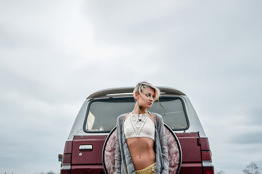 Woman by minivan looking away, Odessa, Odeska Oblast, Ukraine, Europe