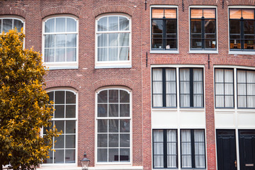 Obraz premium Traditional dutch medieval houses in Amsterdam capital of Netherlands