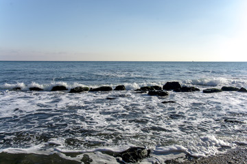 Fototapeta na wymiar sea ​​waves of stones