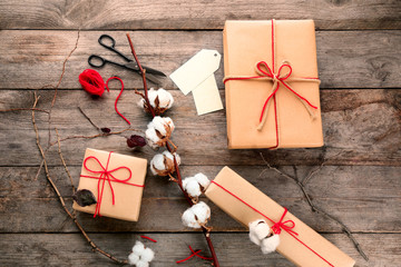 Composition with parcel gift boxes on wooden background