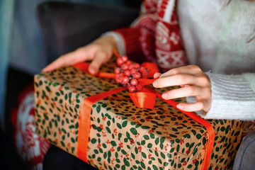 Female hands opening Christmas gift box