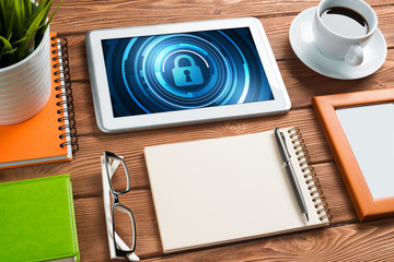 Web security and technology concept with tablet pc on wooden table