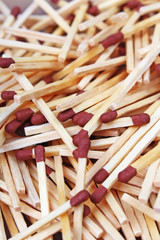 Match sticks with brown heads in a row. Fire Matches texture pattern concept. Stacked matches as background. Wooden sticks.