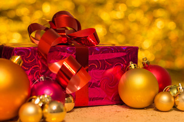 Christmas gift with Christmas toys is on the table