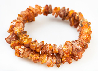bracelet from wild amber stones on white