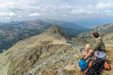 Fototapeta premium Hiker taking a nap in the mountain