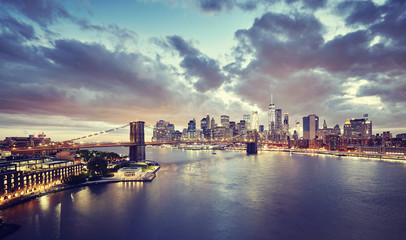 Naklejka na ściany i meble Vintage toned picture of a scenic sunset over New York City, USA.