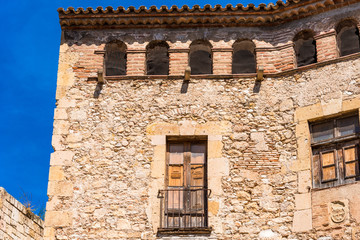 Fototapeta na wymiar View of an old building on a blue background, Tarragona, Catalunya, Spain.