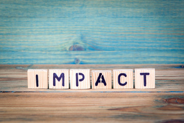 impact - name from wooden letters. Office desk, informative and communication background. - obrazy, fototapety, plakaty