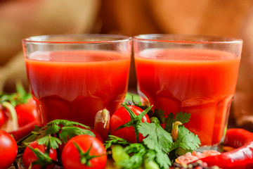 Glass of tomato juice with fresh tomatoes