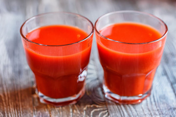 Glass of tomato juice with fresh tomatoes