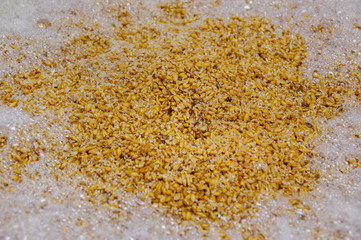 Close up of wheat grains inside of a modern kettles, vessels, in a beer plant in Quito