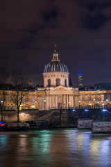 Fototapeta premium River Seine with Pont des Arts and Institut de France at night in Paris