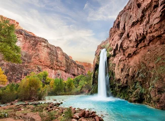 Fototapeten Beautiful Blue Waterfall coming out of canyon © MeganBetteridge
