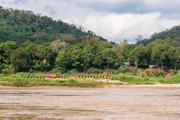 Fototapeta na wymiar View of the Nam Khan river, Louangphabang, Laos. Copy space for text.