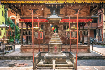 ancient temple hinduist with holy decoration in the playground in patan. kathmandu. nepal
