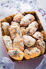 Christmas stollen slices with icing sugar,
