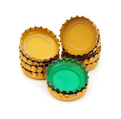 Decorative beer caps on white background