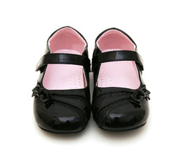 Black shine leather girl shoes isolated on white