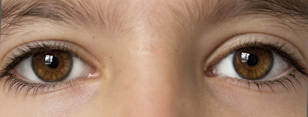 Fototapeta premium Eyes of a 10-year-old girl photographed closely.