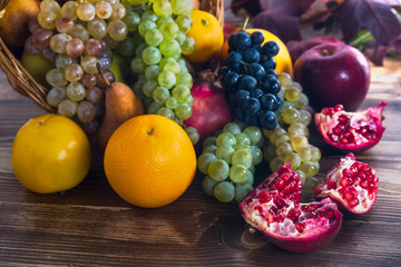 Composition with assorted fruits in wicker basket, healthy life